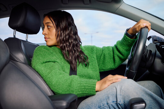 Woman drives a car