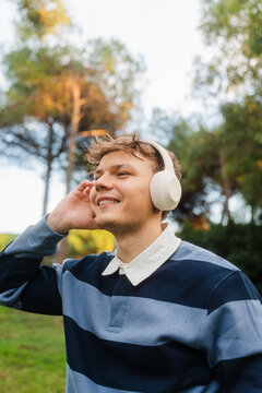 Happy man relishes music outside