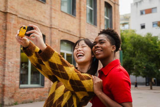 Friends take selfies with disposable camera