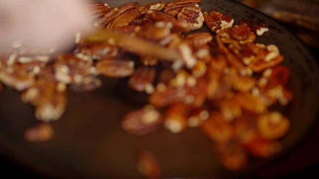 Pecan Nuts Roasting In Frying Pan. Delicious Ingredient For Gourmet Dessert 