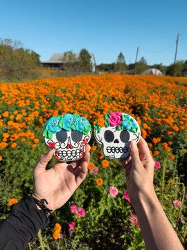 Couple Holding Dia de Los Muertos  Cookies