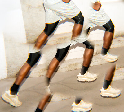 Running Athlete Captured in Motion on an Urban Street