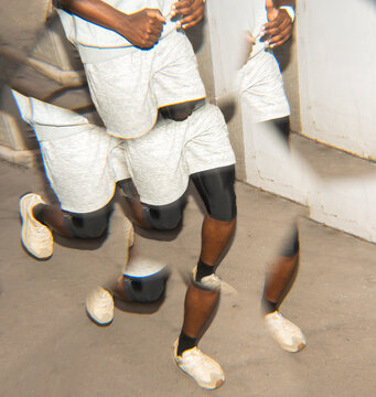 Man Running in Athletic Wear Inside a Modern Urban Space