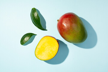 Flat lay with mango on color background, top view