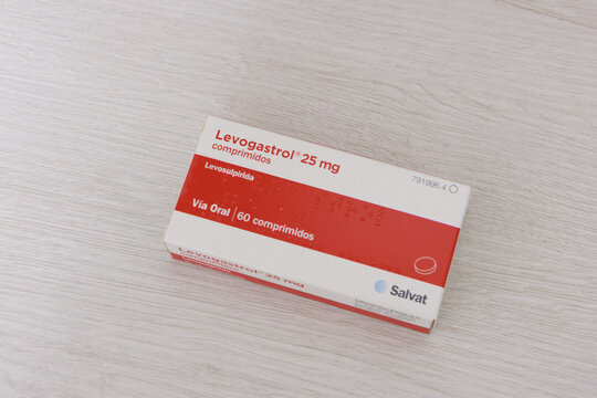 Pamplona, ​​Spain - February 12, 2026.The image shows a box of medicine placed on a light wooden surface. It contains Levogastrol 25 mg tablets, whose active ingredient is levosulpiride. 
