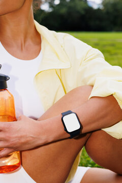 Fitness Mockup Watch with White Screen and Water Bottle in Park