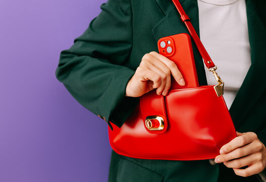 Red handbag and smartphone