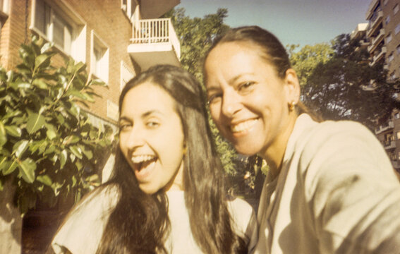 Analog selfie of mother and adult daughter having fun outdoors