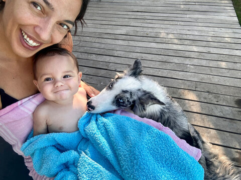 Smiling Woman With Baby And Border Collie Puppy Taking Selfie