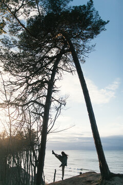 Dancing woman on a shore