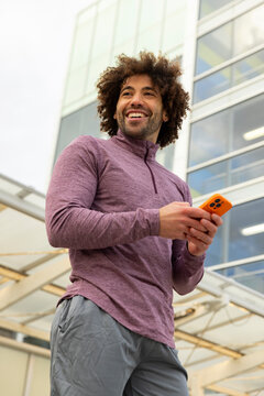 Casual  Portrait black man mobile  phone outdoors 