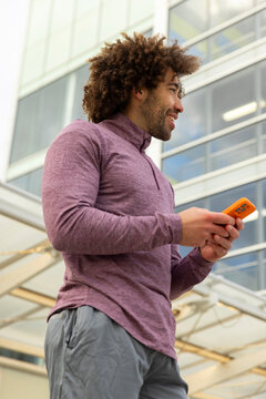 Casual  Portrait handsome black man cell phone outdoors 
