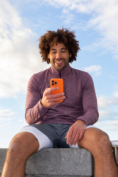 Flash  Portrait black man cell  phone outdoors 