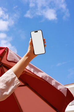 Travel Summer Phone Mockup with White Screen Under Clear Blue Sky