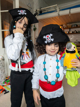Two Children Dressed as Pirates Having Fun Indoors