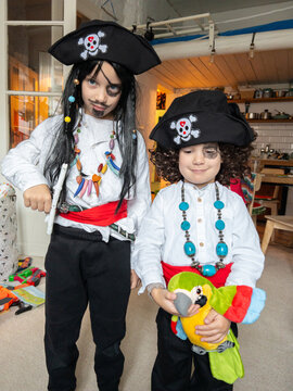 Kids in handmade pirate costumes are ready for a Halloween masquerade