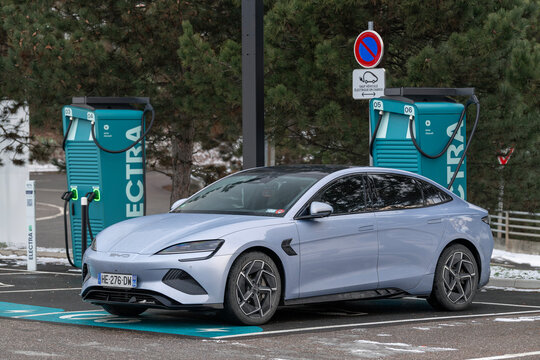 Houdemont, France - January 6th 2026 : View on a blue BYD Seal parked on a parking lot charging at a fast charging station.