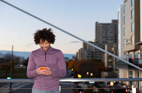 Casual  Portrait black athlete cell phone texting