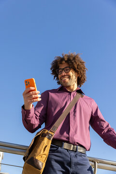  Portrait black man look down at  cell phone 