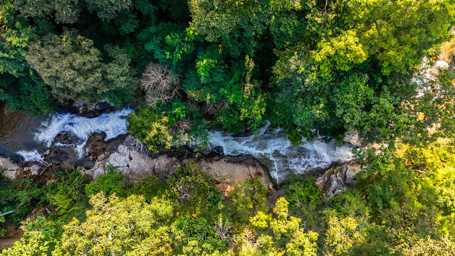 Aerial Mae Sae Waterfall cascading through jungle Chiang Mai Thailand