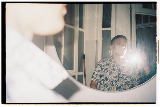 Self-portrait With Reflection in a Circular Mirror at Home