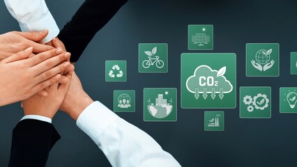 A diverse group of hands joins together to symbolize teamwork and collaboration in a professional...