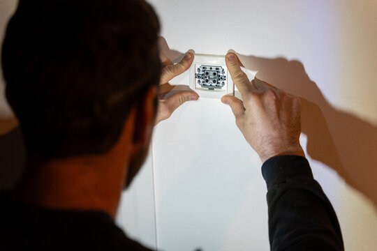 Electrician Installing Wall Socket