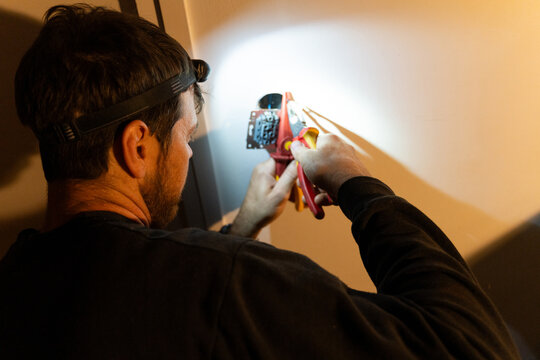 Electrician Installing Wall Socket