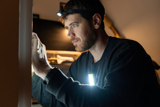 Electrician Adjusting Wall Socket