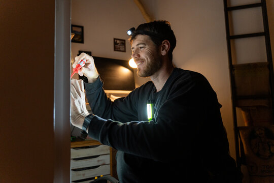 Electrician Adjusting Wall Socket