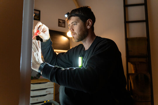 Electrician Adjusting Wall Socket