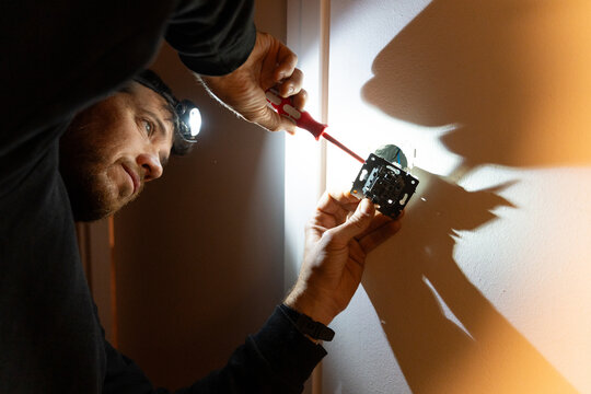 Electrician Installing Wall Socket