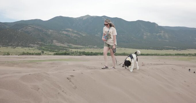 Lady WEalking Her Aussiedoodle Dog at Colorado Great Sand Dunes