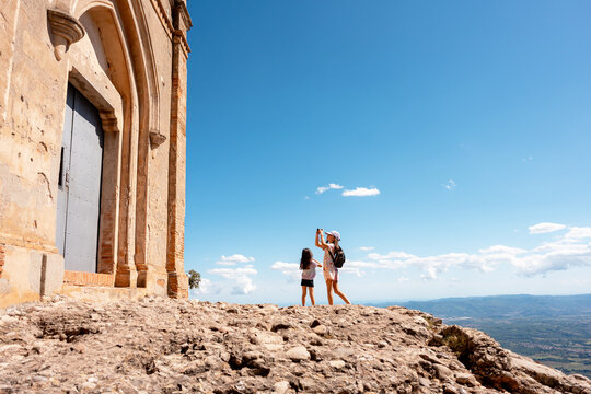 Kids taking photos with camera. Montserrat Catalonia mountain hike