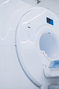CT - Computer tomography imaging scan device in Hospital. Medical Equipment and Health Care. CT - Computerized Tomography Scan Device in Hospital. MRI scaner room . High quality photo. Without people