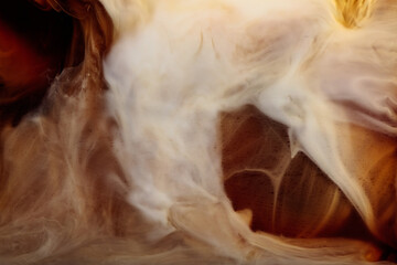 Obraz premium Cream is poured into a glass with iced coffee.