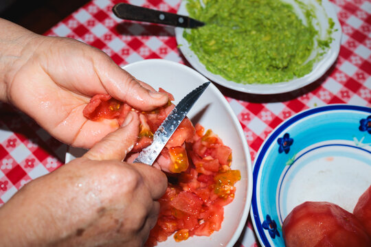 Chopping Fresh Tomatoes for Homemade Dinner