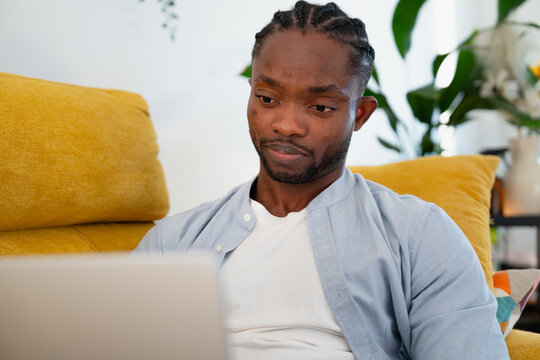 Man working on laptop from home