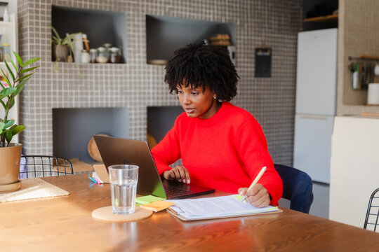 Woman doing paperwork at home