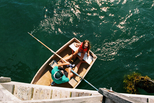 Father and daughter together in row boat