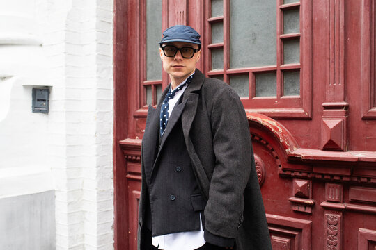 a man fashionably dressed on the street