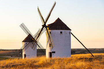 Traditional windmills standing at sunset in Mota del Cuervo Spain