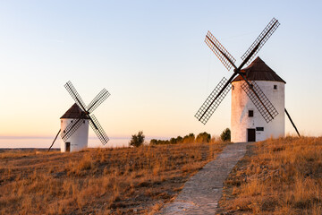 Fototapeta premium Traditional windmills standing on a hill at Mota del Cuervo Spain