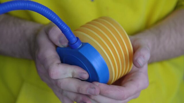 Manual Plastic Hand Pump Inflating with Hissing Air Sound Under Pressure
