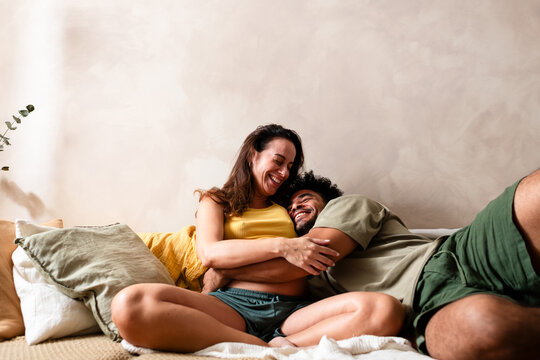 Playful Affection Between Expecting Couple
