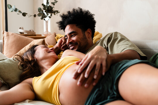 Interracial Couple Enjoying Pregnancy Together