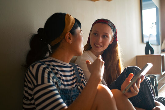 Women friends talking and connecting at home
