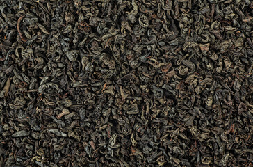 Fototapeta premium Dried Ceylon blend tea leaves as background, top view. Black tea texture surface.