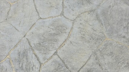 Obraz premium Natural grey stamped concrete or stone texture with a random flagstone pattern. Rough, rugged surface. Gray hexagonal printed concrete texture background.