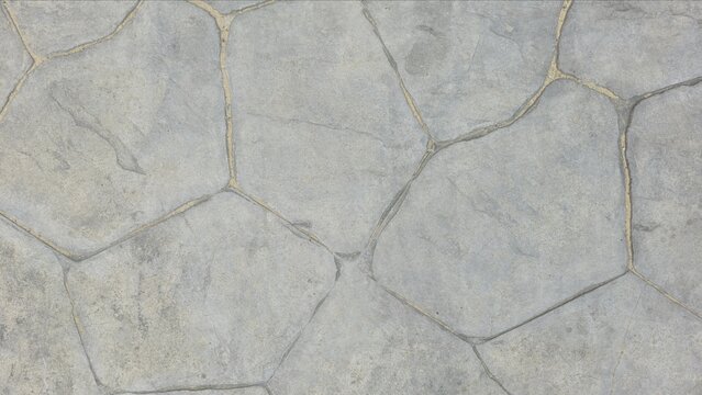 Natural grey stamped concrete or stone texture with a random flagstone pattern. Rough, rugged surface. Gray hexagonal printed concrete texture background.